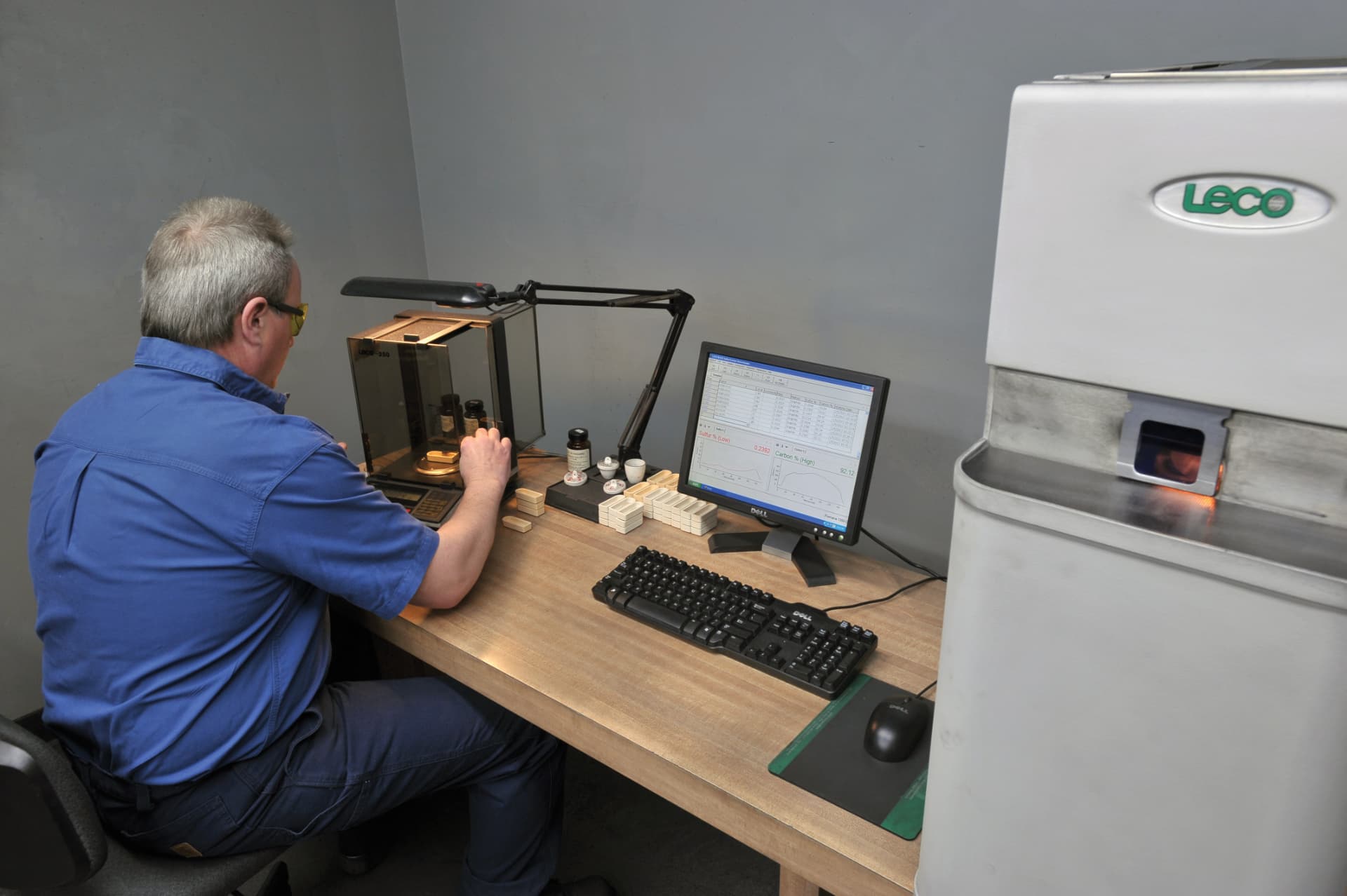 Larpen laboratory technician running carbon and sulfur analysis